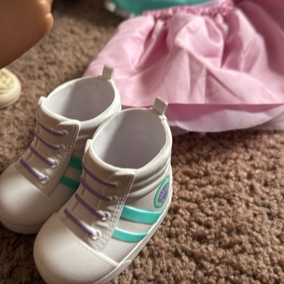 American girl dolls with some clothes and shoes and other items. - Picture 7 of 9